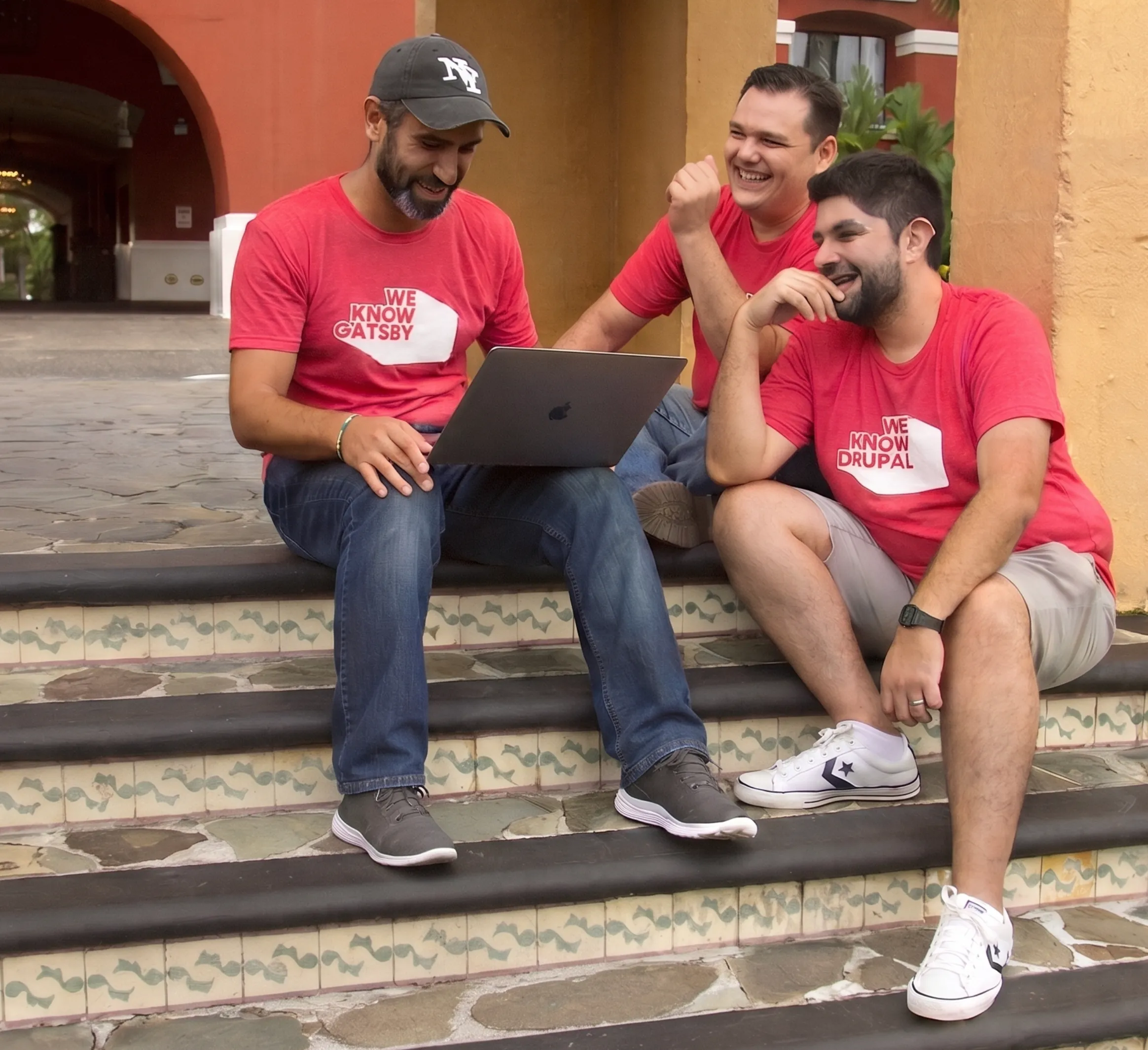 weKnow engineers collaborating over a laptop outdoors in Costa Rica